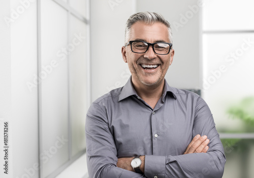 Confident businessman posing in the office