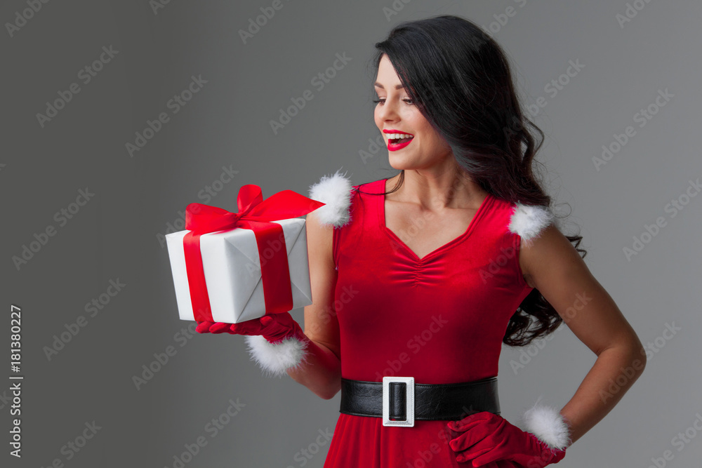 Woman in santa hat with gift Woman in santa hat with gift