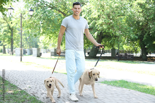 Young man walking yellow re...