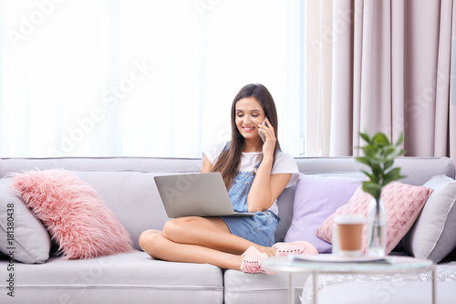 Young woman with laptop at ...