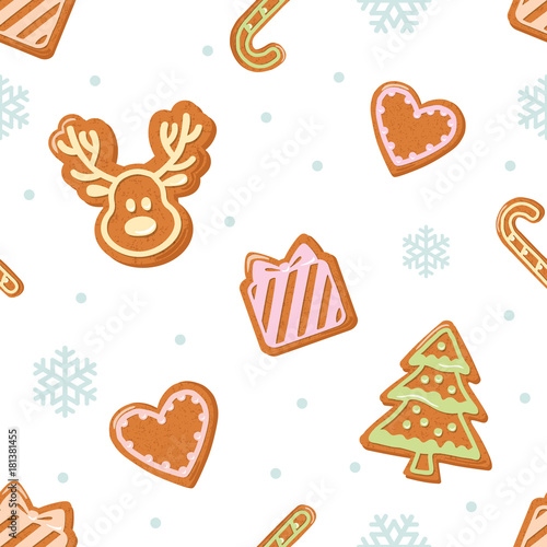 Christmas seamless pattern. Gingerbread cookies and snowflakes isolated on white.