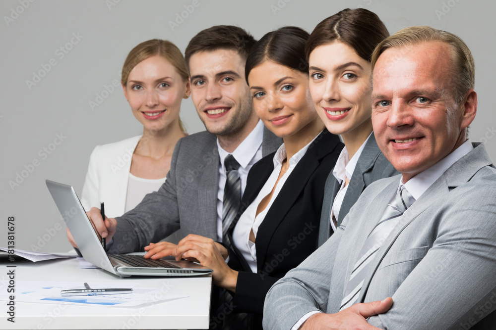 Business people sitting in a row Business people sitting in a row