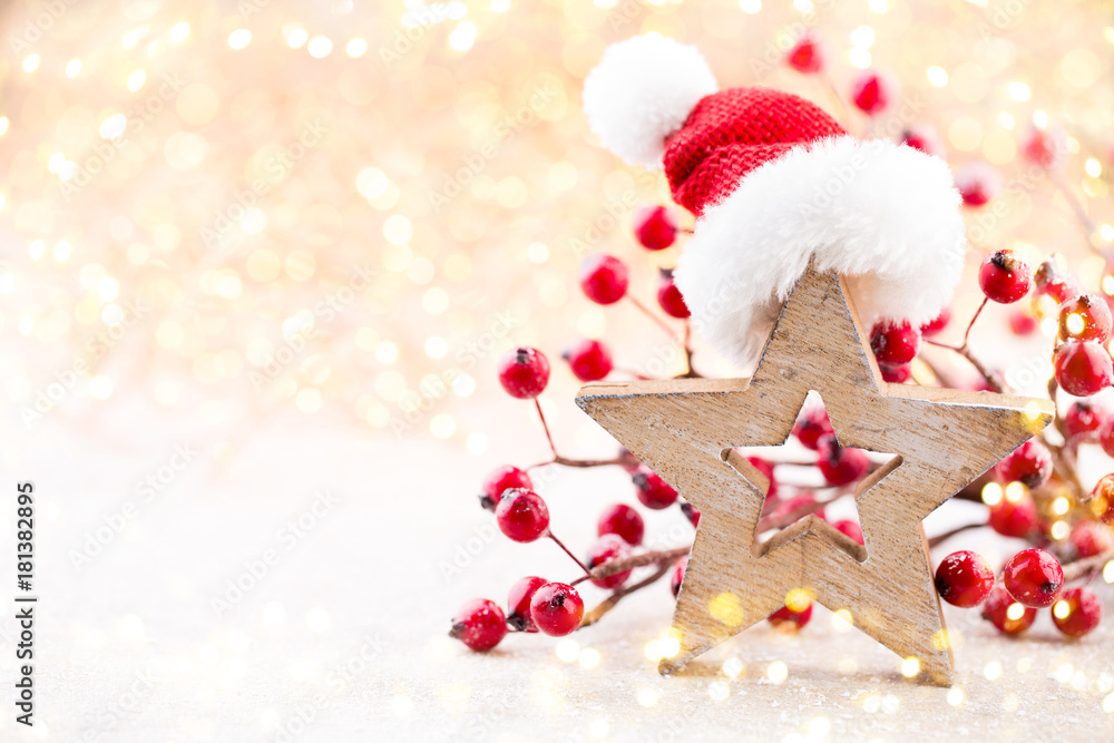 Christmas background. Christmas star and santa hat. Greeting card.