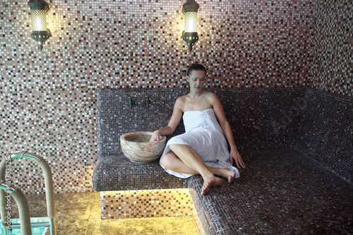 Woman sitting in hammam photo