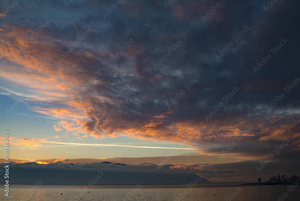 Dramatic Sky and Sunset Over Orcas Island, Washington, USA. A beautiful winter sunset over Orcas Island as seen from Lummi Island in the Pacific Northwest area of Washington state. Dramatic Sky and Sunset Over Orcas Island, Washington, USA. A beautiful winter sunset over Orcas Island as seen from Lummi Island in the Pacific Northwest area of Washington state.