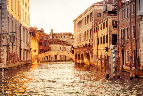Canal in Venice at sunset, Italy. Beautiful view of Venetian street.