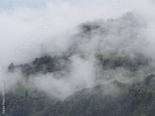 Fog at the village in the carpatian mountains