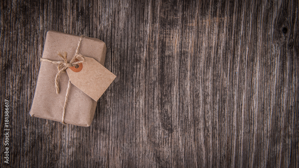 Mockup with handmade gift box on rustic wood Mockup with handmade gift box on rustic wood