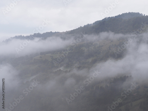 Fog at the village in the carpatian mountains © Sergii Mironenko