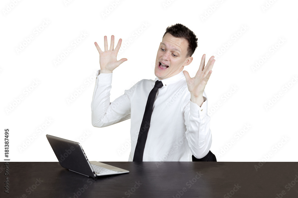 American businessman looks surprised on studio American businessman looks surprised on studio