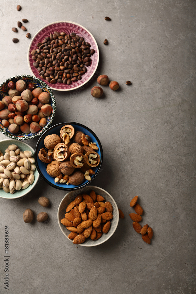 Assorted nuts on gray background Assorted nuts on gray background
