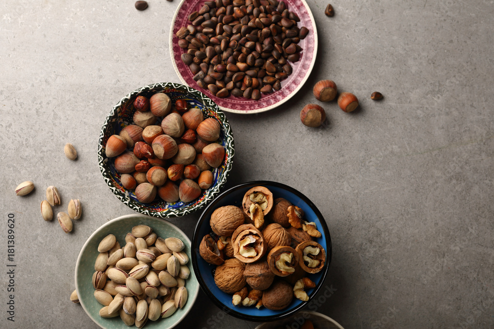 Assorted nuts on concrete background Assorted nuts on concrete background