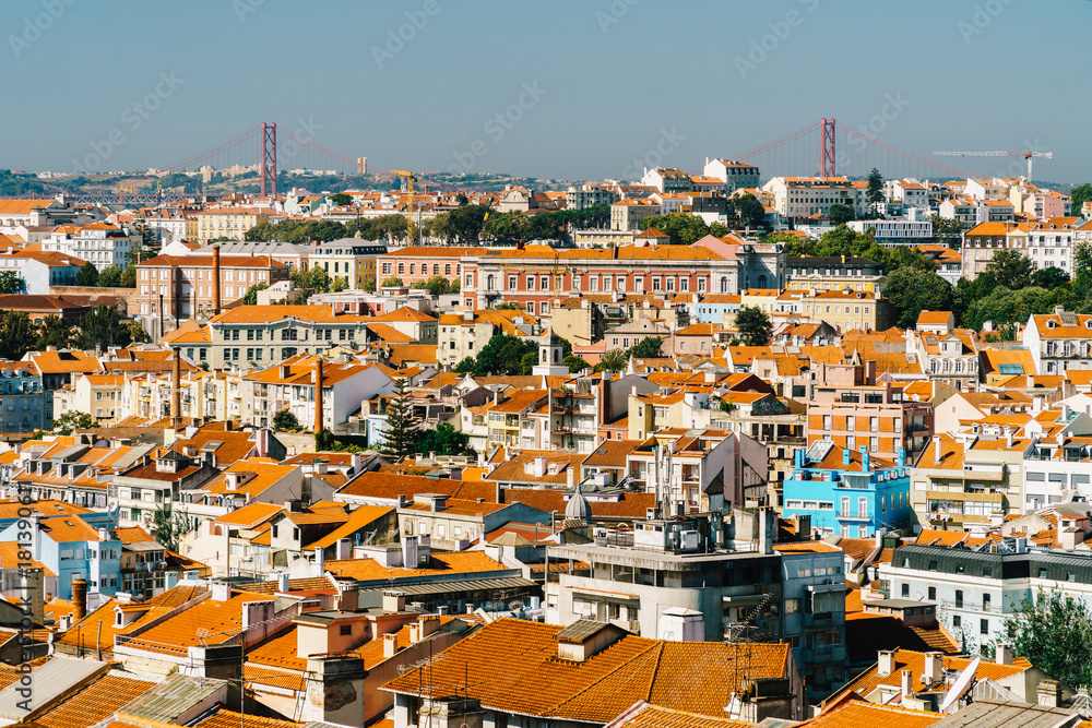 Aerial View Of Downtown Lisbon Skyline Of The Old Historical City And 25 de Abril Bridge (25th April Bridge) In Portugal