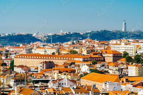 Aerial View Of Downtown Lisbon Skyline Of The Old Historical City And Cristo Rei Santuario  Sanctuary Of Christ the King Statue  In Portugal