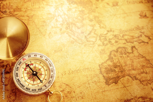 Old vintage compass on vintage map