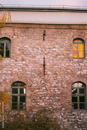 reflection of sunset on old building