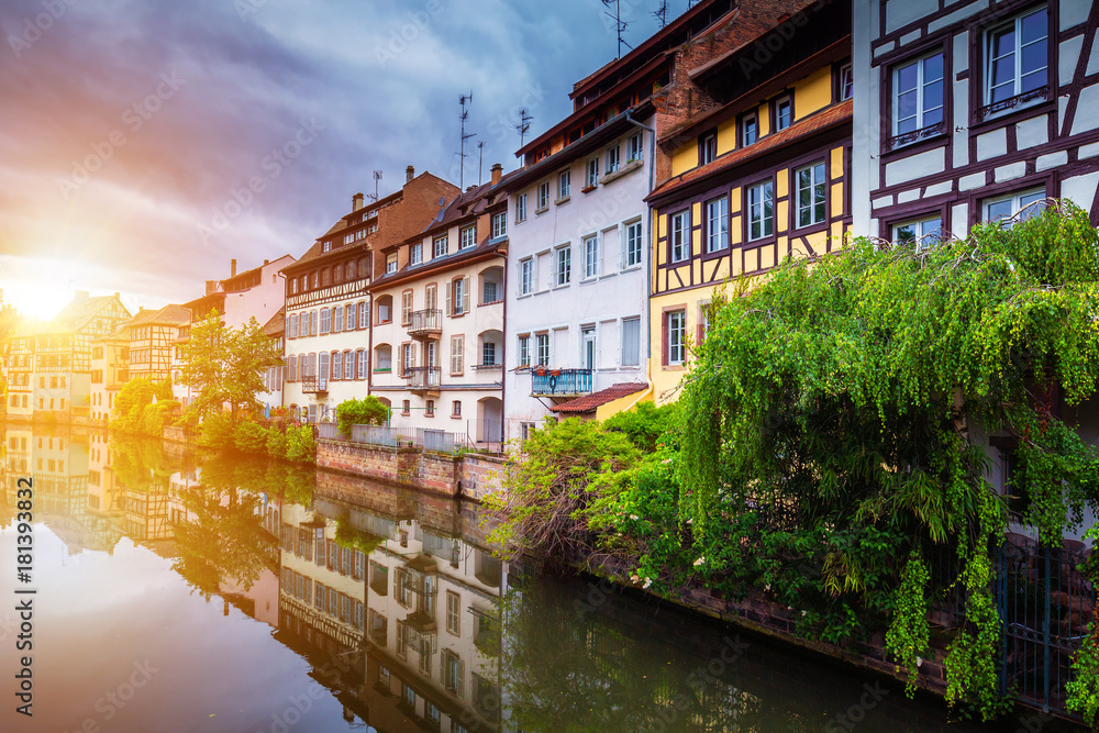 Beautiful view of the historic town of Strasbourg, colorful houses on idyllic river. Strasbourg, France