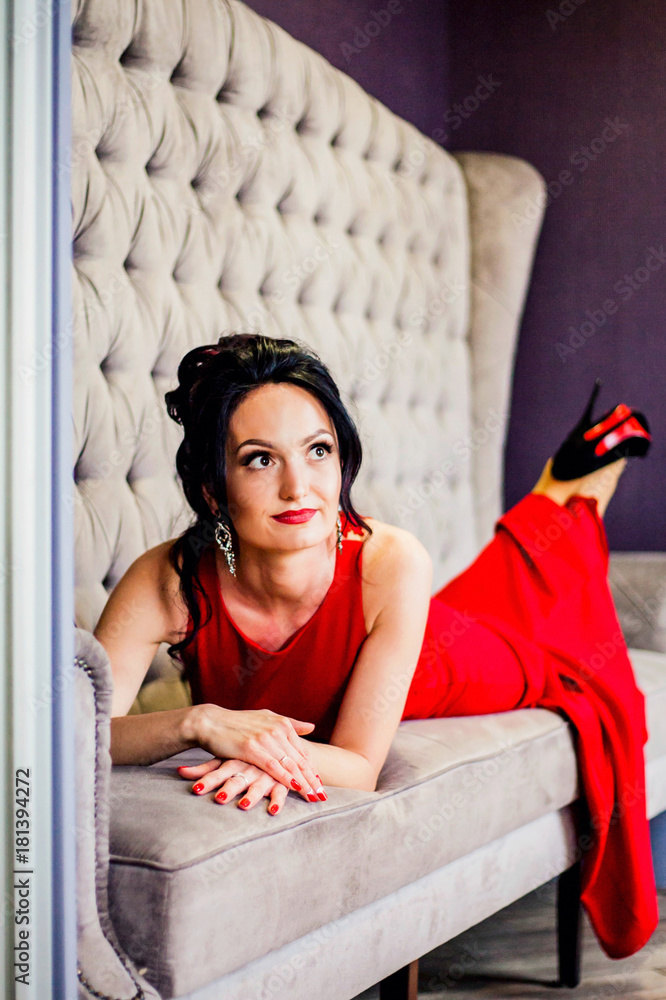 Fototapeta premium Sexy woman posing in red dress