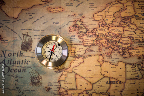 Travel concept background, vintage compas and old earth map