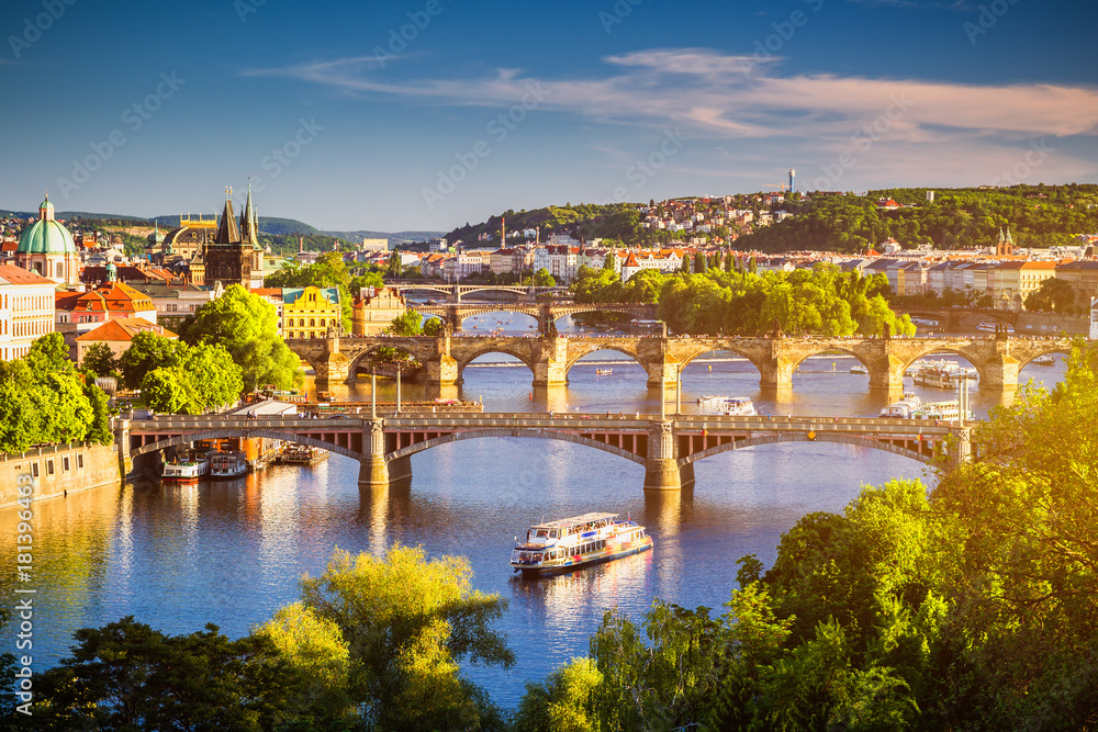 View of the Vltava River and the bridges shined with the sunset sun, Prague, the Czech Republic - obrazy, fototapety, plakaty 