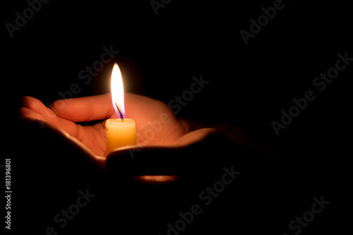 Slika na platnu hands holding a burning candle in dark like a heart
