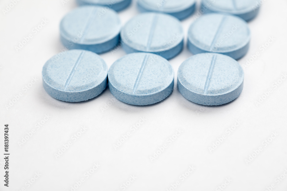 Medications and pills on a white background closeup shot Medications and pills on a white background closeup shot