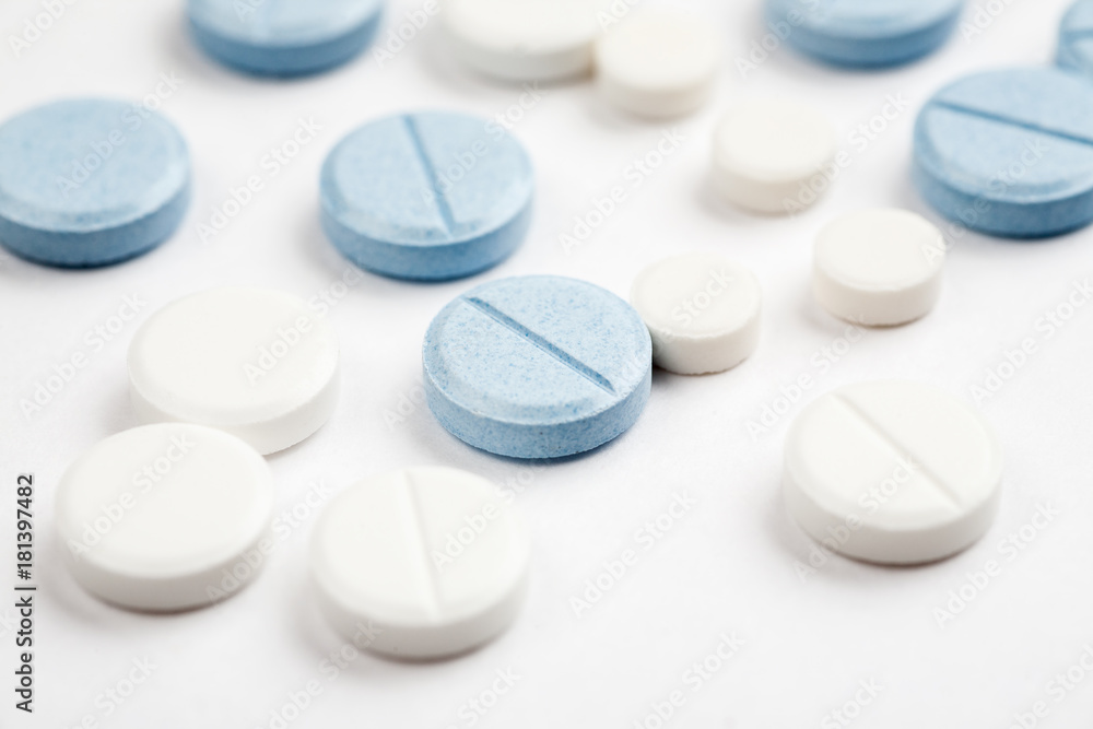 Medications and pills on a white background closeup shot Medications and pills on a white background closeup shot