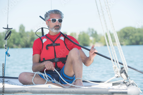 man sailing with sails out on a sunny day © auremar