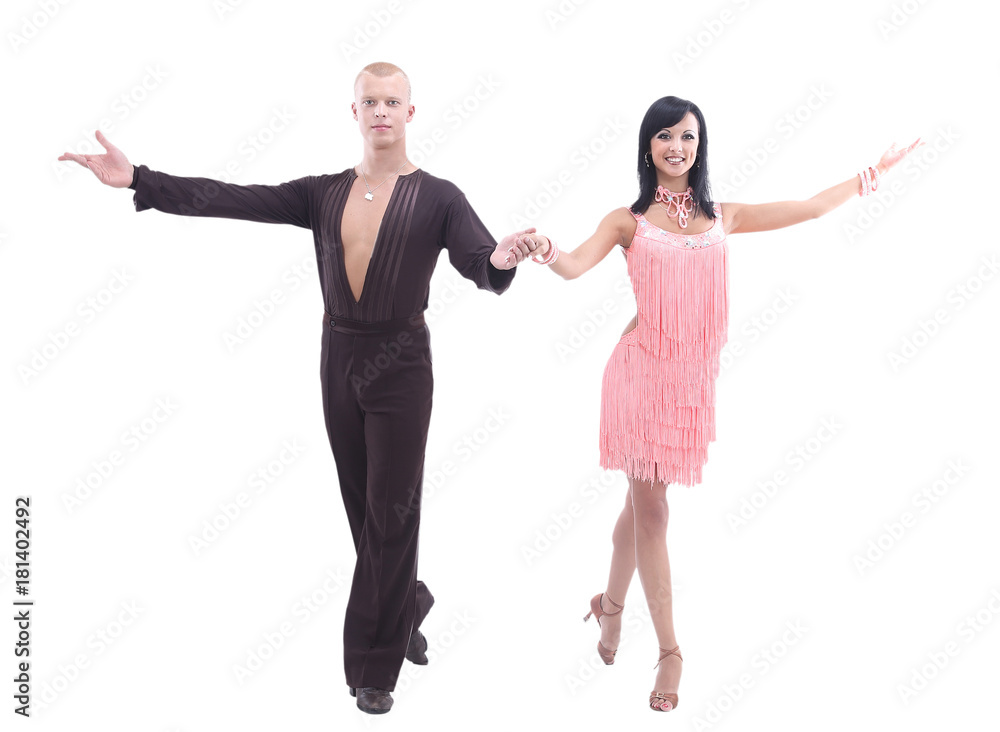 Two young ballroom dancers in studio  against  white background