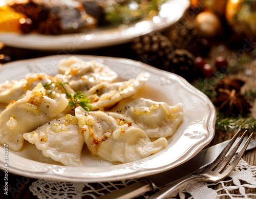 Christmas dumplings stuffed with mushroom and cabbage on a white plate. Traditional Cristmas eve dish in Poland