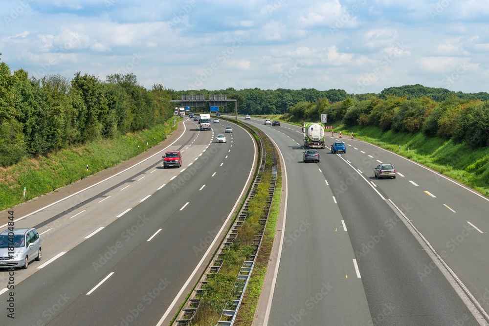 DUSSSELDORF, GERMANY - AUGUST 21 2017: Traffic on a German highway. Cars driving on the highway DUSSSELDORF, GERMANY - AUGUST 21 2017: Traffic on a German highway. Cars driving on the highway