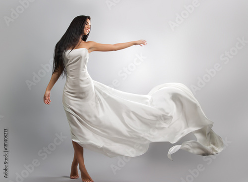 Photos fashion photo of young girl in white dress flying tissue