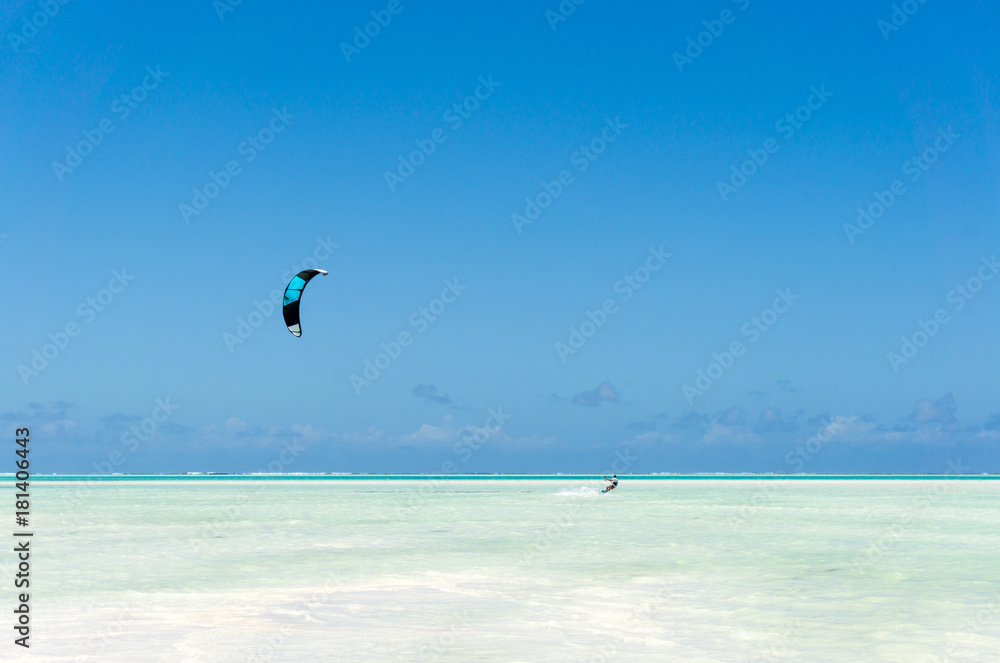 kitesurfing on tropical sea at low tide in Jambiani, Zanzibar, Tanzania Africa kitesurfing on tropical sea at low tide in Jambiani, Zanzibar, Tanzania Africa
