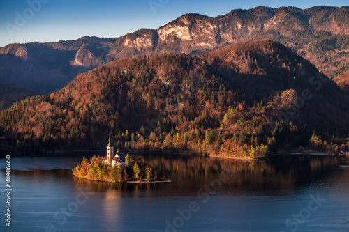 Bled, Slovenia - Beautiful autumn sunrise taken from Bled Castle with the famous Pilgrimage Church of the Assumption of Maria with Julian Alps at background