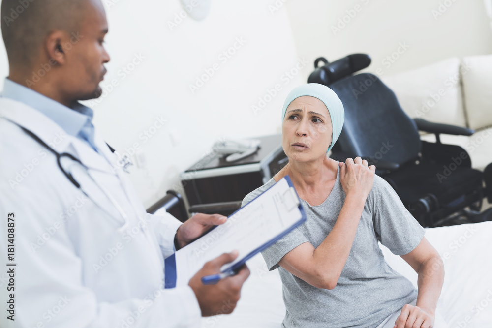 The doctor interrogates the woman. A woman undergoes rehabilitation after cancer treatment. The doctor interrogates the woman. A woman undergoes rehabilitation after cancer treatment.