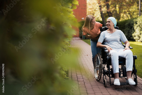 Photography A woman with cancer is sitting in a wheelchair