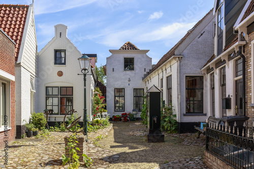 Street view with typical houses and architecture in Den Burg, village on the wadden island Texel. photo