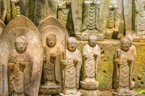 A lots of stone Jizo Bodhisattva statues background. Hase-dera in Kamakura, Japan. Hasedera is one of the largest Buddhist temples in the city within a pilgrimage circuit of the goddess Benzaiten.