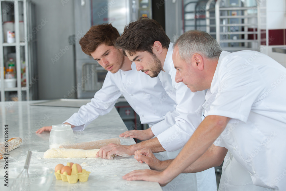 Obraz premium chef and apprentices