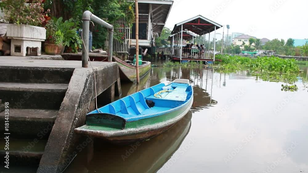 Long tail boat on the river with quiet atmosphere on the bank of the river in Thailand. Long tail boat on the river with quiet atmosphere on the bank of the river in Thailand.