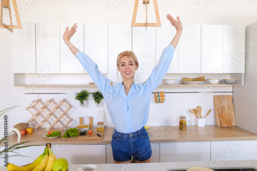 Adorable girl happy with beginning of new day and prepares tomor photo