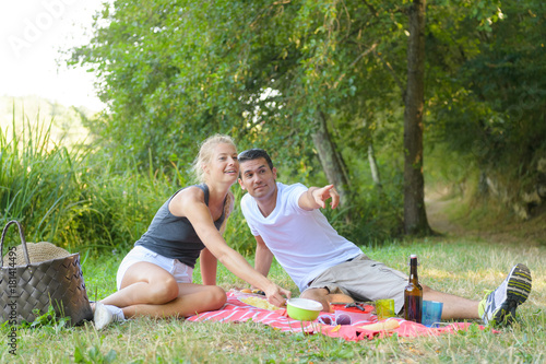 young man and woman at picnic © auremar