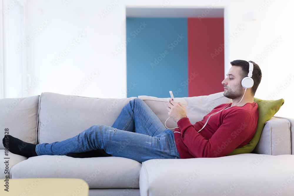 man enjoying music through headphones man enjoying music through headphones