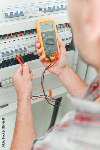 Electrician using a device
