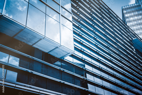 Clouds Reflected in Windows of Modern Office Building..