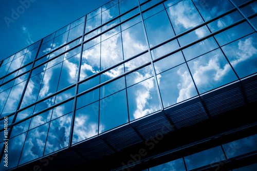 Clouds Reflected in Windows of Modern Office Building..