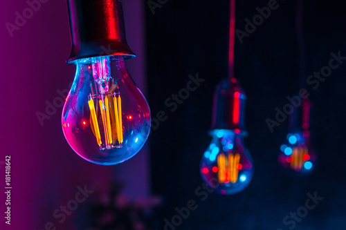 Unusual lamps hang in a row...