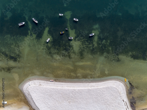 Aerial seascape top down view over Cavacos beach, in Ria Formosa wetlands natural park. Algarve.