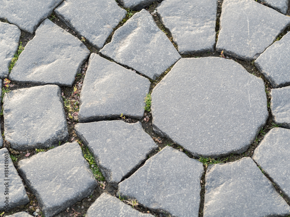 Obraz premium The texture of a street cobblestone road. Texture background