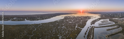 Aerial sunset seascape in Ria Formosa wetlands natural park, inland maritime channel. Algarve. photo
